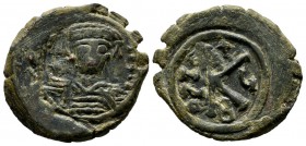 Maurice Tiberius, AD 582-602. AE Half follis (25mm, 7.64g). Constantinople. d N mAVR CIT P P AVG. Helmeted and cuirassed bust facing, holding globus c...