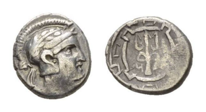 Ionia, Magnesia ad Maeandrum Obol Circa 400-350 BC., AR 8mm., 0.71g. Helmeted he...