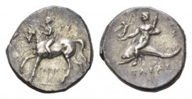 Calabria, Tarentum Nomos Circa 272-240, AR 22.5mm., 6.59g. Naked boy-jockey crowning horse, standing l, and lifting off fore leg. In r. field, ΓY and ...