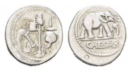 Julius Caesar. Denarius circa mint moving with Caesar 49-48., AR 18mm., 3.67g. Pontifical emblems: culullus, aspergillum, axe and apex. Rev. Elephant ...