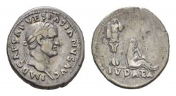 Vespasian, 69-79 Denarius circa 69-early AD 70, AR 18mm., 3.20g. IMP CAESAR VESPASIANVS AVG Laureate head r. Rev. IVDAEA Judaea seated right, head res...