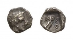 Attica, Athens Tetartemorion after 393, AR 5.5mm., 0.20g. Head of Athena r., wearing crested Attic helmet with three olive leaves over visor and spira...