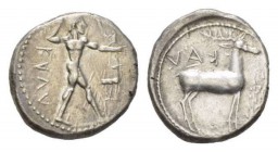 Bruttium, Caulonia Nomos 475-425, AR 22mm., 8.21g. KAVΛ Naked Apollo standing r., holding branch in raised r. hand: on extended l. arm small running f...