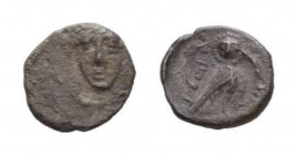Judaea, Yehud Hemiobol Before 333 BC, AR 7mm., 0.20g. Facing head in a circle of connected dots. Rev. Owl standing r., head facing. Hendin 430.

Rar...