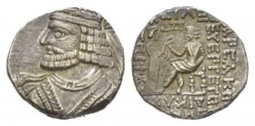 Parthia, Vologases I, circa 51-78.Seleucis on tigris Tetradrachm 52-53, AR 26.5mm., 14.72g. Diademed and draped bust l. Rev. Vologases seated l. on th...