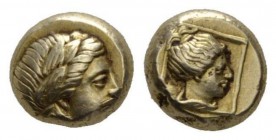 Lesbos, Mytilene Hecte 337-326, EL 10mm., 2.57g. Laureate head of Apollo r. Rev. Female head r. within square frame. Bodenstendt 95.

Obverse slight...