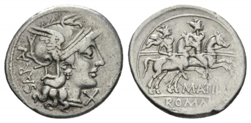 M. Atilius Serranus Denarius 148, AR 20.5mm., 3.63g. Helmeted head of Roma r., b...