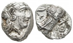 Attica, Athens Tetradrachm Late 4th early III century, AR 18mm., 16.56g. Head of Athena r., wearing crested Attic helmet. Rev. AΘE Owl, with closed wi...