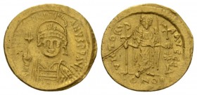 Justinian I, 527-565 Solidus Constantinople 527-565, AV 20.5mm., 4.39g. D N IVSTINIANVS P P AVG Helmeted and cuirassed bust facing, holding globus cru...