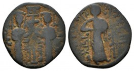 Nur al-din Mahmud ibn Zengi (541-569/1146-1174) Fals Halab (Aleppo). 1146-1174, Æ 21mm., 4.25g. Two Byzantine style imperial figures standing facing, ...