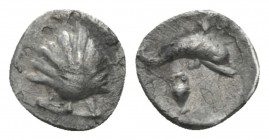 Calabria, Tarentum Litra circa 325-280, AR 10mm., 0.59g. Cockle shell. Rev. Dolphin r.; below, anphora. Vlasto 1528. Historia Numorum Italy 979.

Go...