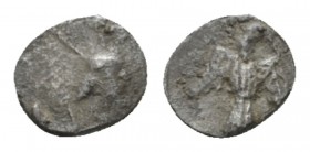 Judaea, Achaemenid Province (Yehud). Half Gerah circa 375-332, AR 7mm., 0.25g. Bearded head r., wearing crown (mostly off-flan). Rev. Falcon facing, h...