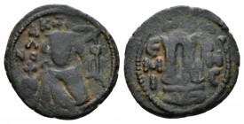 Temp. Abd Al-Malik Ibn Marwan, 685-705 Fals Emesa circa 690, Æ 21.5mm., 4.73g. 685-705 Fals circa 690, Æ 21.5mm., 4.99g. Facing bust of Emperor. Rev. ...