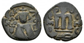 Temp. Abd Al-Malik Ibn Marwan, 685-705 Fals Emesa circa 690, Æ 19mm., 3.06g. Facing bust of Emperor. Rev. Monogram. Walker type 66.

Very Fine.

 ...