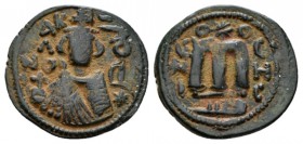 Temp. Abd Al-Malik Ibn Marwan, 685-705 Fals Emesa circa 690, Æ 22mm., 3.82g. Fals circa 690, Æ 21.5mm., 3.41g. Facing bust of Emperor. Rev. Monogram. ...
