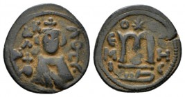 Temp. Abd Al-Malik Ibn Marwan, 685-705 Fals Emesa circa 690, Æ 20mm., 4.33g. Fals circa 690, Æ 21.5mm., 3.41g. Facing bust of Emperor. Rev. Monogram. ...