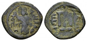 Temp. Abd Al-Malik Ibn Marwan, 685-705 Fals Jerusalem circa 690, Æ 21.5mm., 3.44g. Emperor standing facing. Rev. Monogram. Walker type 73-75.

About...