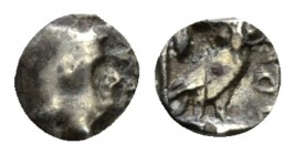 Judaea, Yehud coinage Obol circa IV cent BC, AR 6mm., 0.30g. Head of Athena facing right, wearing a crested helmet decorated with an olive-wreath. Rev...