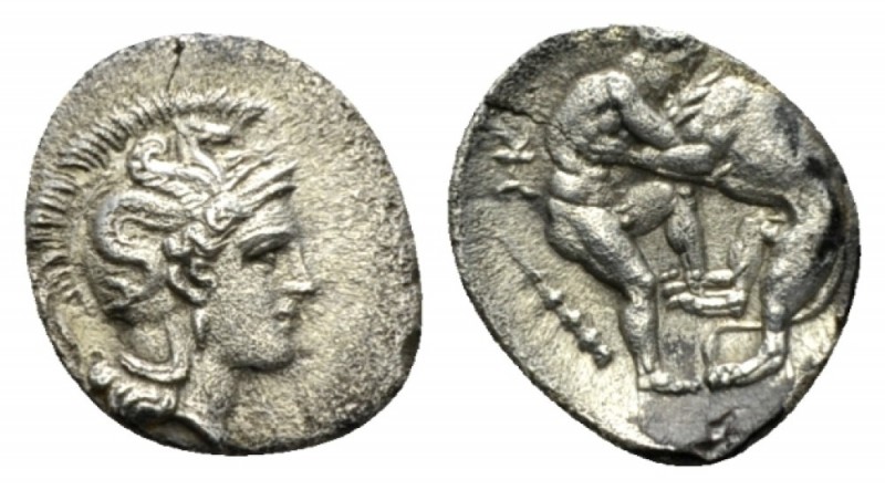 Calabria, Tarentum Obol circa 380-325, AR 12mm., 1.05g. Helmeted head of Athena ...