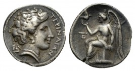 Bruttium, Terina Tetrobol circa 300, AR 16mm., 2.26g. TEPINAIΩN Head of nymph r.; in l. field, triskeles. Rev. Nike seated on cippus l., holding bird;...