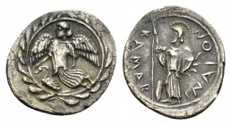 Sicily, Camarina Litra circa 461-435, AR 14.5mm., 0.81g. Nike flying l.; below, swan, all within wreath. Rev. KAMAPINAION Athena standing l., holding ...
