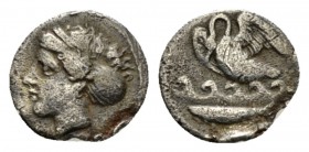 Sicily, Camarina Litra circa 410-405, AR 11mm., 0.74g. Head of nymph l., wearing sphendone. Rev. Swan l.; below, waves and fish. SNG ANS 1210. SNG Llo...