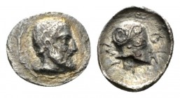 Sicily, Himera Litra circa 470-450, AR 9.50mm., 0.55g. Bearded male head r., wearing hairband. Rev. HIMERA (retr.) Corinthian helmet, within incuse sq...