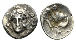 Calabria, Tarentum Diobol circa 325-280, AR 11.5mm., 1.14g. Head of Heracles, wearing lion's skin, facing three quarters l. Rev. Heracles strangling N...