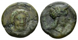 Bruttium, Medma Bronze circa 340-330, Æ 21.5mm., 5.27g. Facing bust of Persephone, head slightly r., grain ears in hair. Rev. Laureate head of Apollo ...