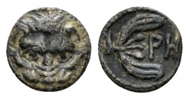 Bruttium, Rhegium Litra circa 415-387, AR 10mm., 0.50g. Facing head of lion. Rev. PH within olive twig. SNG ANS 670. Historia Numorum Italy 2499.

T...