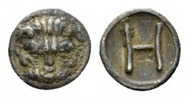Bruttium, Rhegium Hemilitron circa 415-387, AR 7.5mm., 0.35g. Facing head of lion. Rev. Large H. SNG ANS 675. Historia Numorum Italy 2500.

Toned. V...