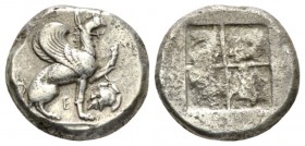 Ionia, Teos Stater 478-449, AR 21mm., 11.75g. Griffin seated r., with l. forepaw raised; below E and crested helm l. Rev. Quadripartite incuse square....