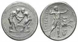 Pamphilia, Aspendos Stater circa 320-280, AR 24.5mm., 9.98g. Two wrestlers grappling, between them, ΠO. Rev. EΣTFEΔIIYΣ Slinger in throwing stance r. ...