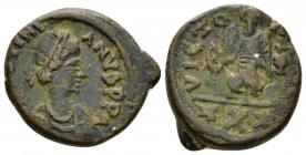 Justianian I, 527-565 Decanummus 527-565, Æ 18.5mm., 4.95g. Diademed and cuirassed bust r. Rev. Victory standing facing, holding cruciger globe. Sear ...