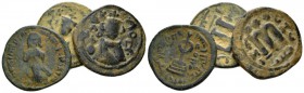 Temp. Abd Al-Malik Ibn Marwan, 685-705 lot of three fals circa 690, Æ 20.5mm., 11.54g. Lot of three fals: Emperor standing facing. Rev. Cross potent. ...