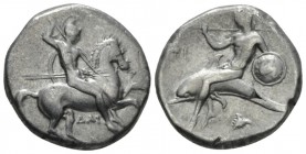 Calabria, Tarentum Nomos circa 325-281, AR 20mm., 7.69g. Warrior, holding shield and two spears, preparing to cast a third, on horseback r.; ΔAI below...