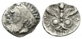 Sicily, Catana Litra circa 415-405, AR 10.5mm., 0.54g. Head of Silenus l., wearing broad taenia. Rev. Winged thunderbolt ending in lotus flower, flank...