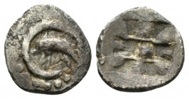 Sicily, Messana as Zankle/ Litra circa 500-493, AR 10mm., 0.50g. Dolphin swimming left within crescent harbour. Rev. Nine-part incuse square with cock...