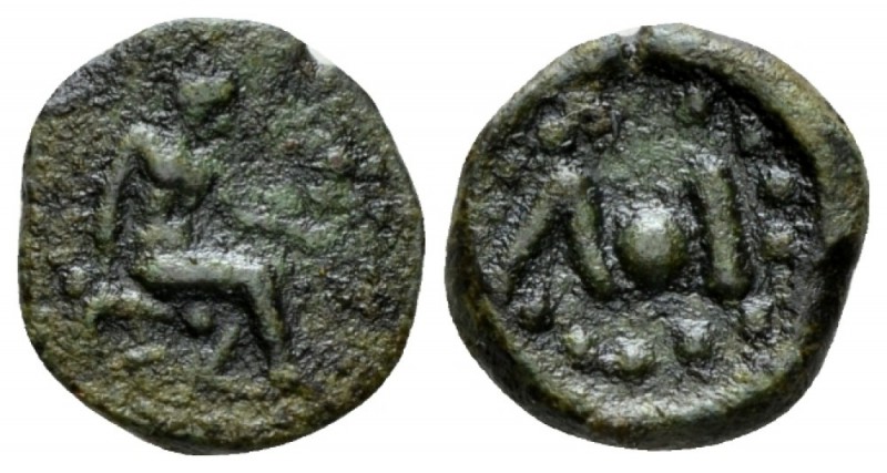 Island of Sicily, Lipara Uncia circa 425-400, Æ 11.5mm., 1.08g. Ephaestus seated...