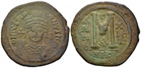 Justinian I, 527-565. Follis Nicomedia circa 539-540 (year 13), Æ 42mm., 22.93g. Helmeted and cuirassed bust facing, holding globus cruciger and shiel...