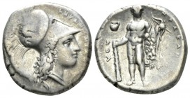 Lucania, Heraclea Nomos circa 340-330, AR 20.5mm., 7.80g. Head of Athena r., wearing crested Corinthian helmet, decorated with a Skylla hurling a ston...