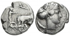 Sicily, Syracuse Tetradrachm circa 425-420, AR 25mm., 17.11g. Charioteer driving fast quadriga r.; Nike above, flying l. and crowning charioteer. Rev....