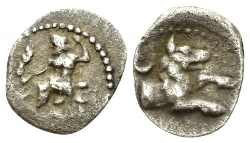 Cilicia, Tarsus Obol IV cent., AR 10.5mm., 0.56g. Baal seated l. Rev. Forepart o...