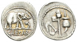 Iulius Caesar. Denarius mint moving with Caesar 49-48, AR 17.5mm., 3.86g. Pontifical emblems: culullus, aspergillum, axe and apex. Rev. Elephant r., t...