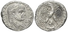 Caracalla, 198-217 Tetradrachm Emesa circa 215-217, AR 25mm., 13.57g. Laureate head r. Rev. Eagle standing facing, head l., with wreath in beak and wi...