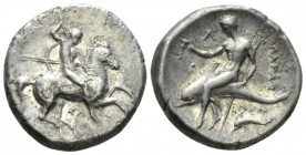 Calabria, Tarentum Nomos circa 315-305, AR 21.5mm., 7.51g. Warrior, preparing to cast spear held in r. hand, holding two spears and shield in l., on h...