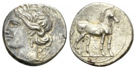 Bruttium, Locri (The Carthaginians in Italy) Quarter of sheke circa 215-205, AR 13.5mm., 1.80g. Head of Tanit-Demeter l., wearing barley wreath. Rev. ...