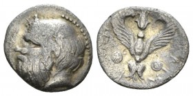 Sicily, Catana Litra circa 420-410, AR 12.5mm., 0.75g. Ivy-wreathed head of Silenus l. Rev. KATA - NAION Winged thunderbolt between two round shields....