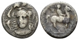 Sicily, Syracuse Hemidrachm circa 344-317, AR 14mm., 1.61g. Helmeted head of Athena facing slightly l.; around, three dolphins. Rev. Horseman riding r...
