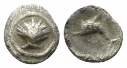 Calabria, Tarentum Litra circa 325-280, AR 7mm., 0.30g. Cockle shell. Rev. Dolphin l.; below, ΦI . Vlasto 1522. Historia Numorum Italy 979. 

Good V...